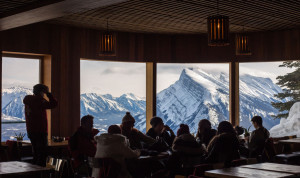 Friends grab a bite to eat at the Cliff House Bistro located at the top of Mount Norquay.
